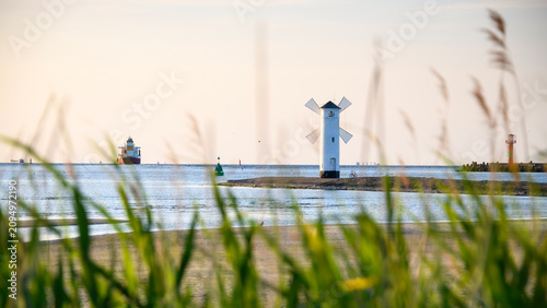 Panoramic image of an old lighthouse in Swinoujscie, a port in Poland on the Baltic Sea.