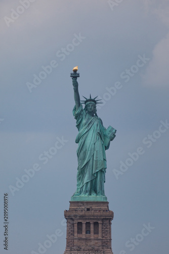 фотографія The Statue of Liberty, a colossal neoclassical sculpture on Liberty Island in New York Harbor, stands as a symbol of freedom and democracy