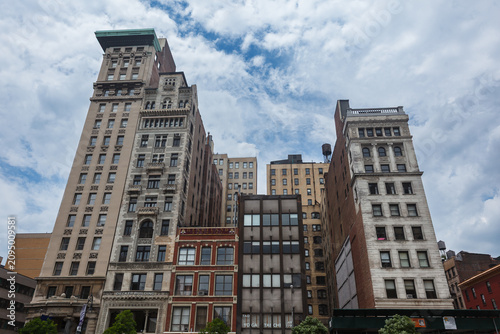 Картината върху платно Series of ornamented towers on top of tall building in New York City