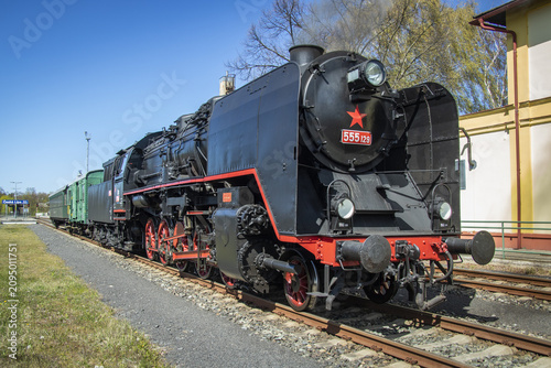 A German wartime steam locomotive arrived at the station with a train.