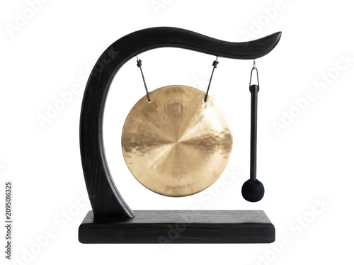 Traditional golden metal gong instrument on a black wooden stand with a mallet for sound and meditation practice isolated on transparent background