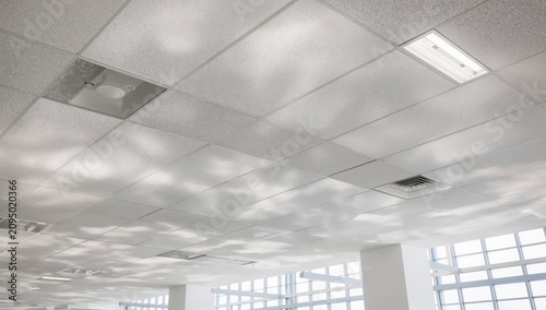 Light Reflects on a Ceiling in a Modern Office During Daytime