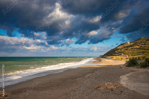 Picturesque views of the Greek island of Euboea. View of the sea and blue sky with fantastic clouds.