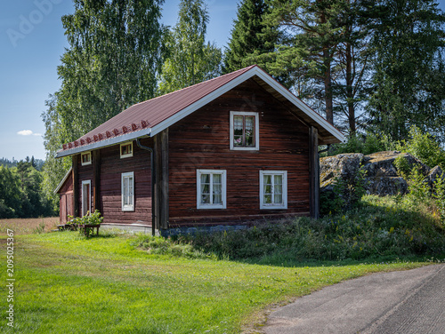 Traditional Red Swedish Farmhouse With White Windows