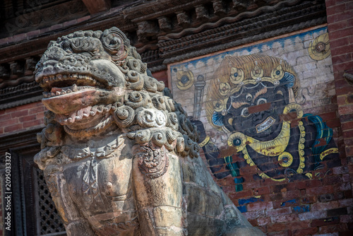 Guardian Lion Statue and Bhairab Mural at Kathmandu Durbar Square