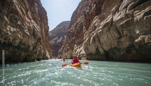 Kayakers Navigate Through a Narrow Canyon in Bright Sunlight During a Summer Day
