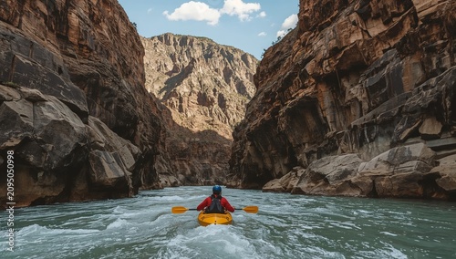Kayakers Navigate Through a Narrow Canyon in Bright Sunlight During a Summer Day