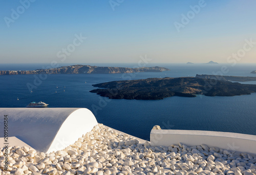 View from Santorini to volcanic island Nea Kamena, Cyclades, Greece