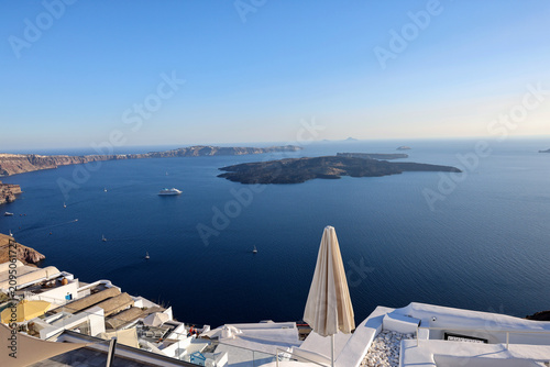 View from Santorini to volcanic island Nea Kamena, Cyclades, Greece