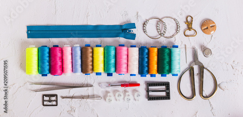 Konstfotografi Accessories and tools for sewing and handicrafts on the work table top view web
