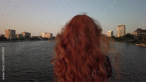 Golden Hour Downtown Riverside Cinematography Woman with Flowing Auburn Hair: Wide Establishing Shots and Intimate Portraits