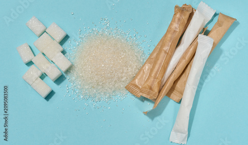 Bilde på lerret Different types of refined sugar cubes, scattered crystals and portioned sticks
