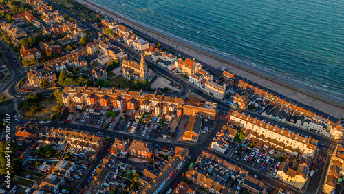 Bild auf Leinwand Aerial drone view of seaside resort residential town properties and church landm