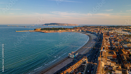 Quadro su tela Panoramic aerial view of weymouth beachfront promenade with portland island vist