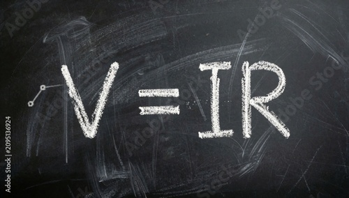 Blackboard word written white chalk large bold font centered there smaller text reads cursive left side arrows