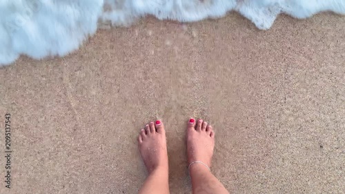 barefoot and waves on the beach, grounding concept.