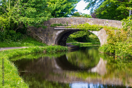Fotografie The stone bridge over The Lancaster Canal at Bolton Le Sands in Lacashire in the