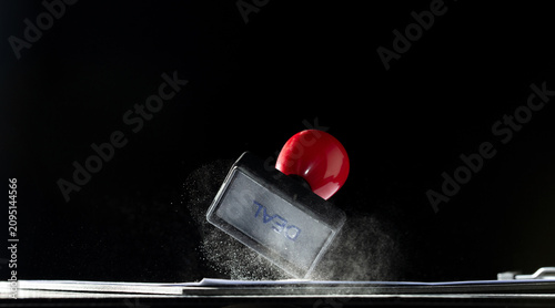 Fotografie Against their will, hand delivers stamp, marking contract with forced approval