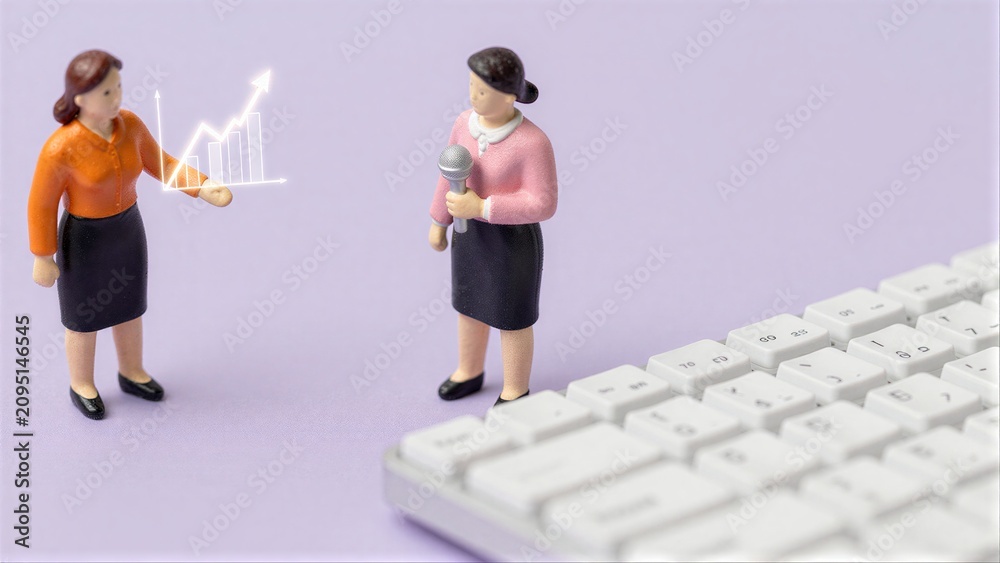 Obraz premium Two miniature businesswomen discuss growth, with a keyboard and graph nearby.