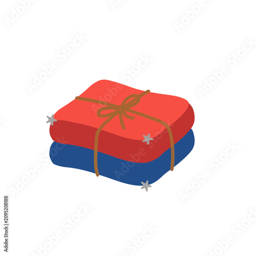 Stack of folded fabric with ribbon and stars