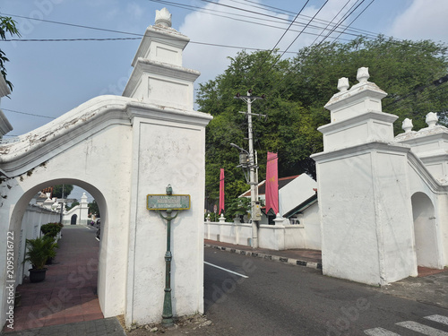 Tablou pe pânză White stone cemetery gate with crosses and archways in religious memorial garden