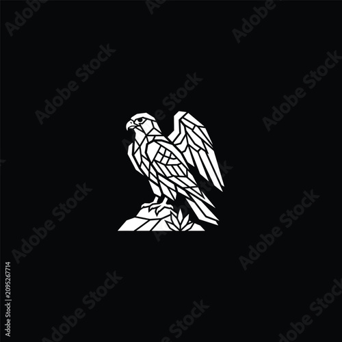 Geometric white eagle perched on a mountain rock.