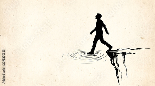Silhouette of a businessman walking confidently across water above a steep cliff edge