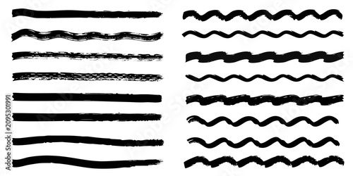 Fotografía thick black ink brush strokes and calligraphy swirls on white background handwri