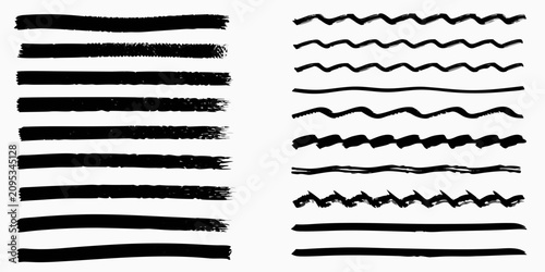 Foto thick black ink brush strokes on white background lines calligraphy swirls artis