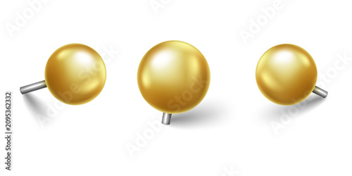 Tableau sur toile Three shiny golden push pins with metallic stems and dark shadows arranged in a