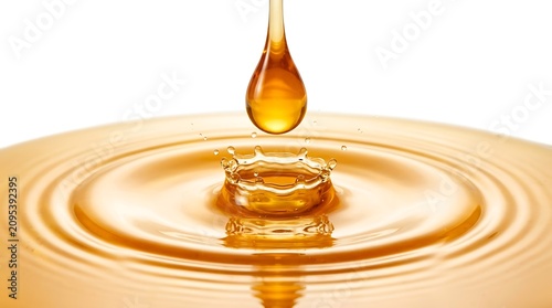 Golden liquid drop, water ripple effect, honey or oil droplet, macro close-up