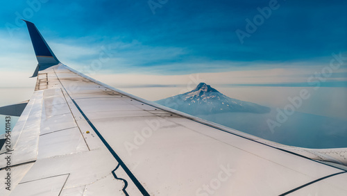 Airplane Wing Over Mount Hood During Flight in Oregon USA