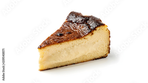A rich slice of Basque burnt cheesecake with a perfectly caramelized top and creamy center, isolated on white background