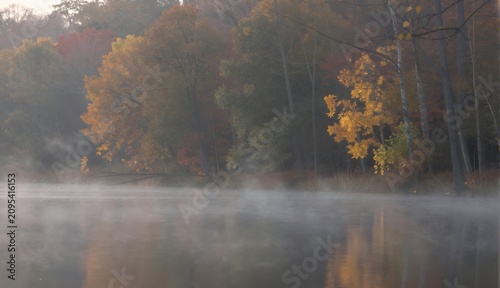 Autumn Mist Over Lake with Colorful Trees