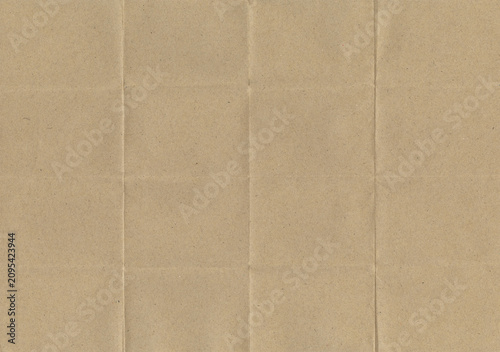 Vintage kraft paper texture background with natural wrinkles and warm beige tone