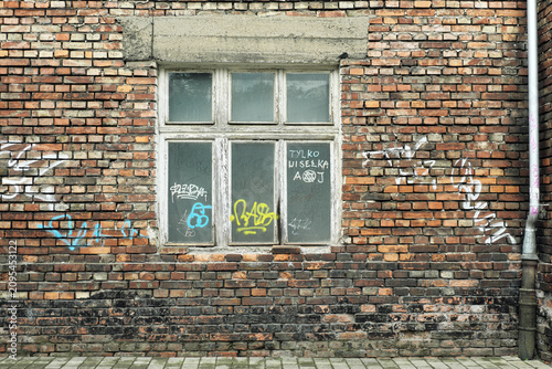 window, brick wall and tag, street and art in Krakow, Poland