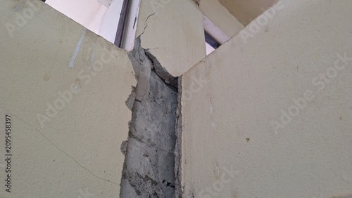 Structural crack between wall and concrete column of building