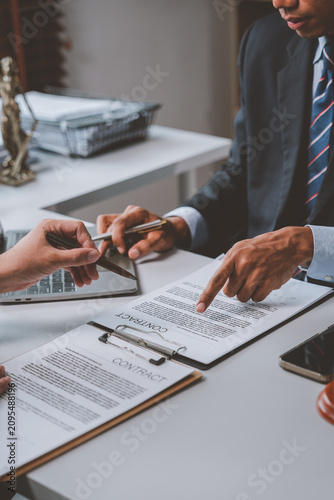 Lawyers discussing contract details and legal agreement