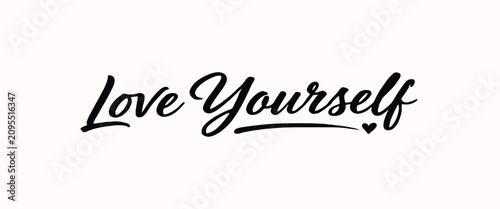 Foto Black calligraphy text love yourself isolated on a white background, with a smal
