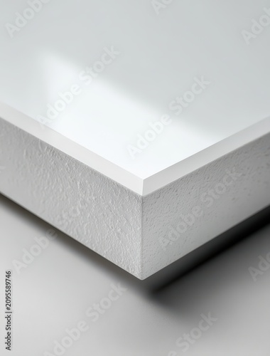 Close-up of textured white surface with shadow