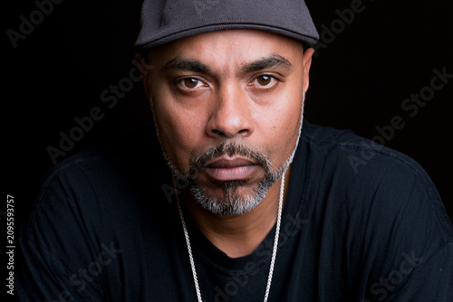 Close Up Portrait of Handsome Black Man Wearing Knit Cap and Black T Shirt