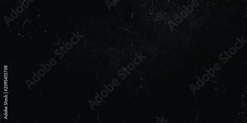 Fotografie Dark black grunge background texture with subtle scratches, dust particles, and