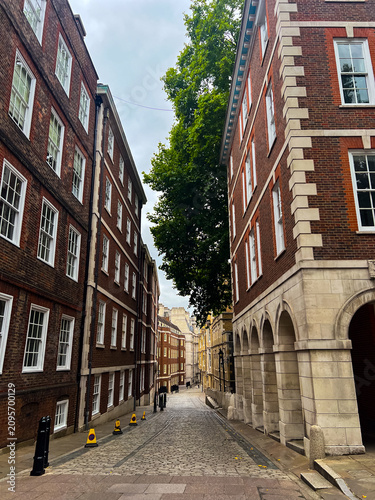 Photography Quiet street in London Temple district lined with historic brick buildings, eleg