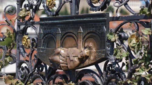 Saint John of Nepomuk relief on the Charles Bridge in Prague, Czechia. Hand of unidentified person touching it for luck and to make a wish.