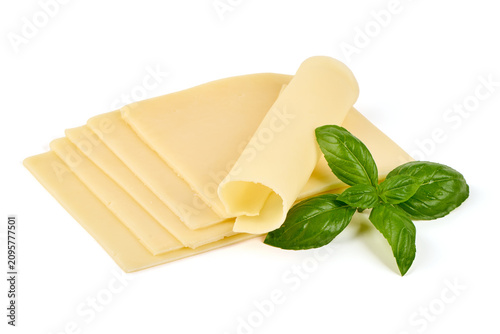 Sliced cheese with basil leaves on a white background