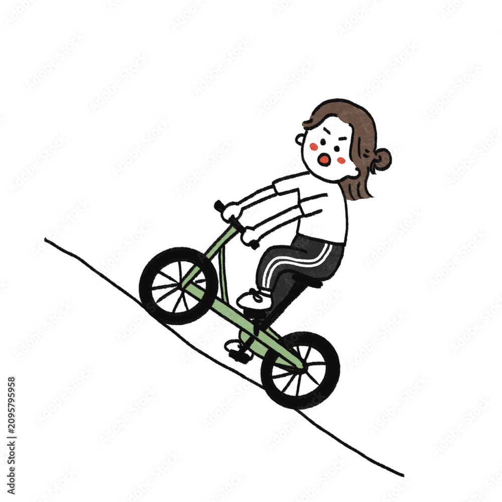 Fototapeta premium 坂道で自転車を漕ぐ女の子