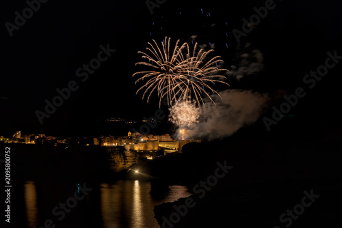 Fireworks exploding over Bonifacio harbor during celebration