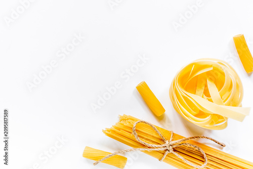 Italian food concept various kind of pasta on white background top view copyspace