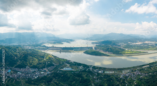 Photography A wide aerial view of the Three Gorges Dam spanning across the large river with