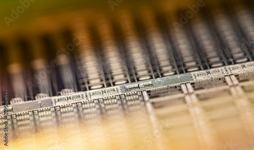 Fotografie Semiconductor wafer with interconnected microchips creating complex circuitry